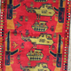 Image for article titled Afghan carpet weavers are putting drones on their rugs